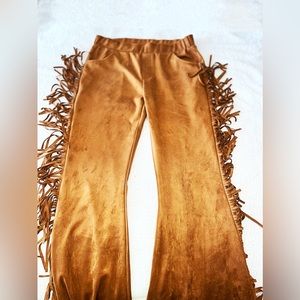 Flared leg pants with fringe.